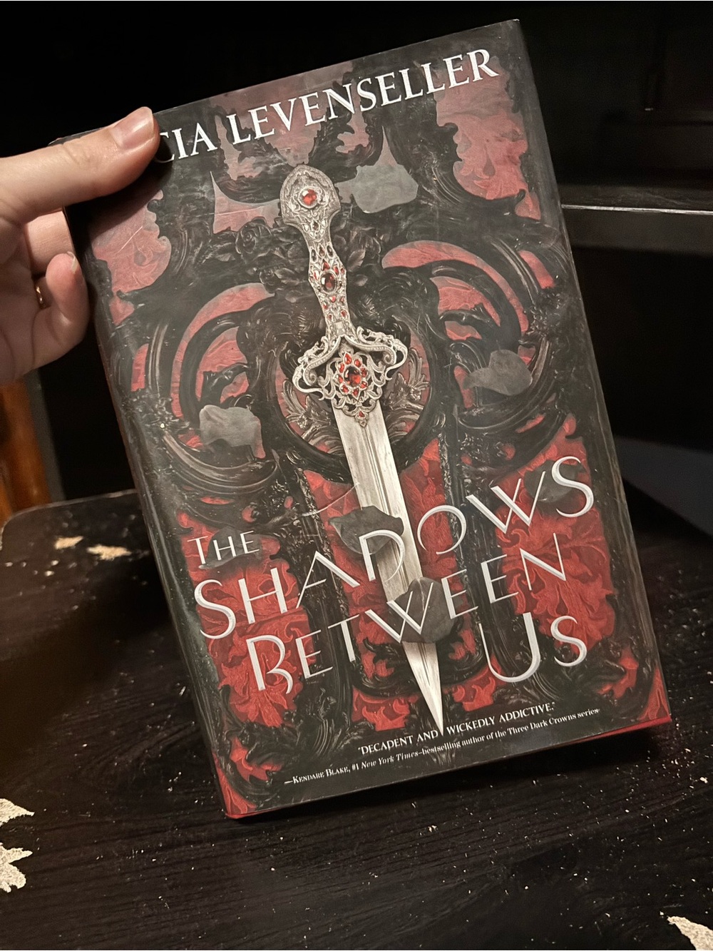 The Shadows Between Us by A. Levenseller - Red & Black Hardcover